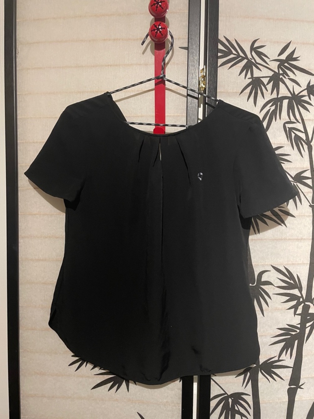Chase Bank black keyhole ruffle top